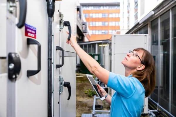 A Mitie engineer checking outdoor equipment